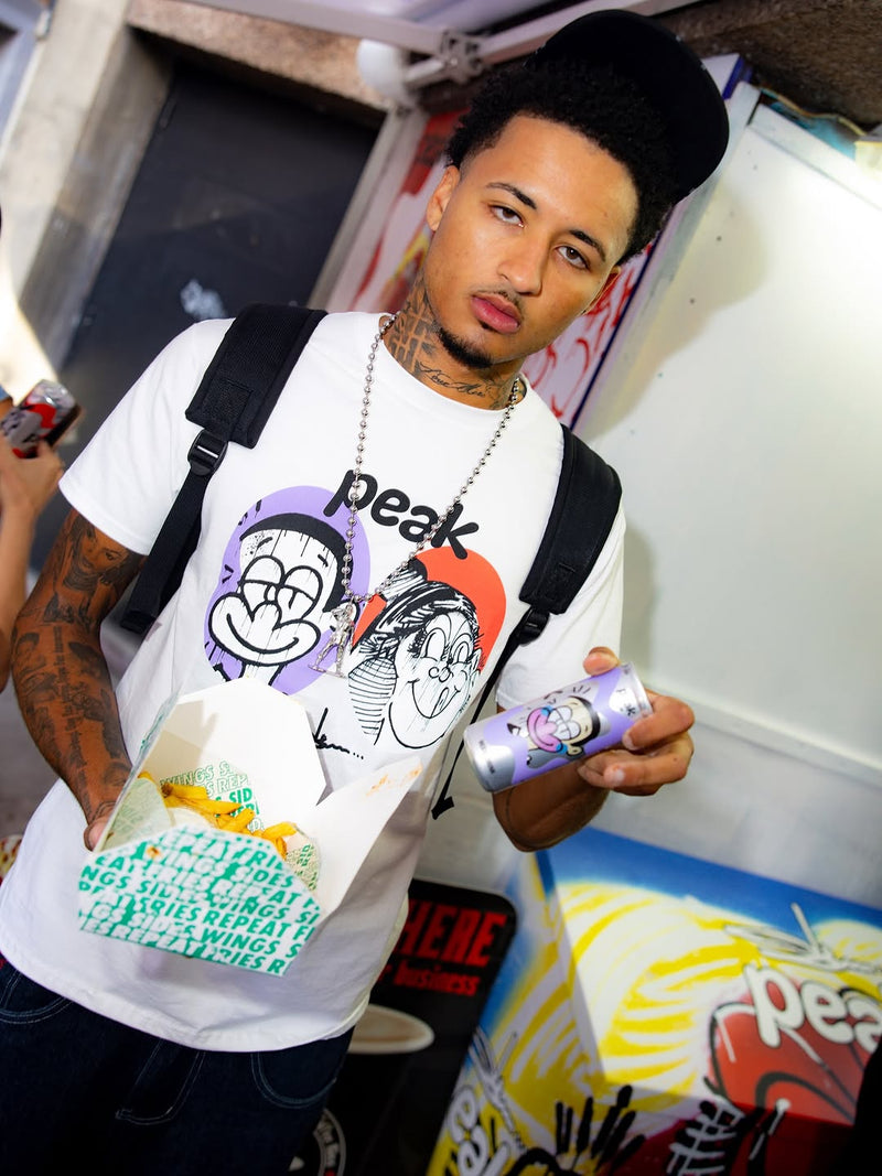 someone wearing the slawn x peak collaboration at the pop up in soho