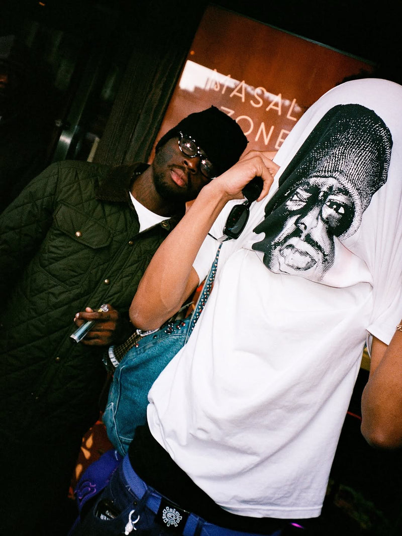 slawn and other wearing the collaboration t shirt at the soho pop up 