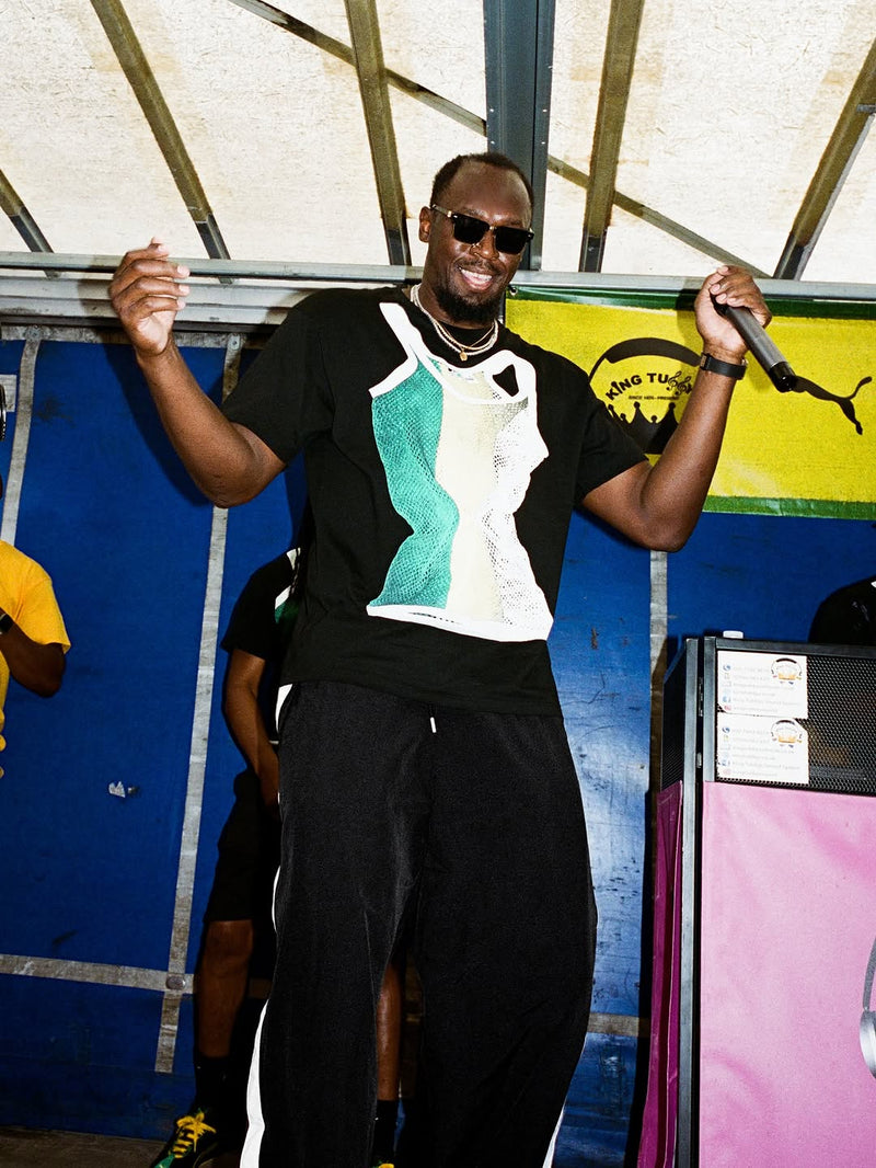 Usain Bolt wearing Sharkinni Carnival tee performing at Notting Hill Carnival